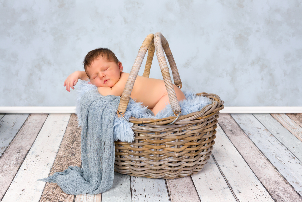 Newborn baby in basket